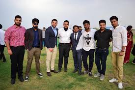 Alumni group at an outdoor campus meetup